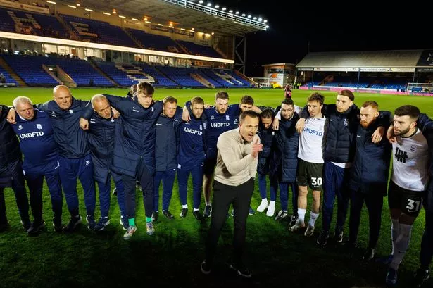 Birmingham City manager Chris Davies gives a speech to players and staff