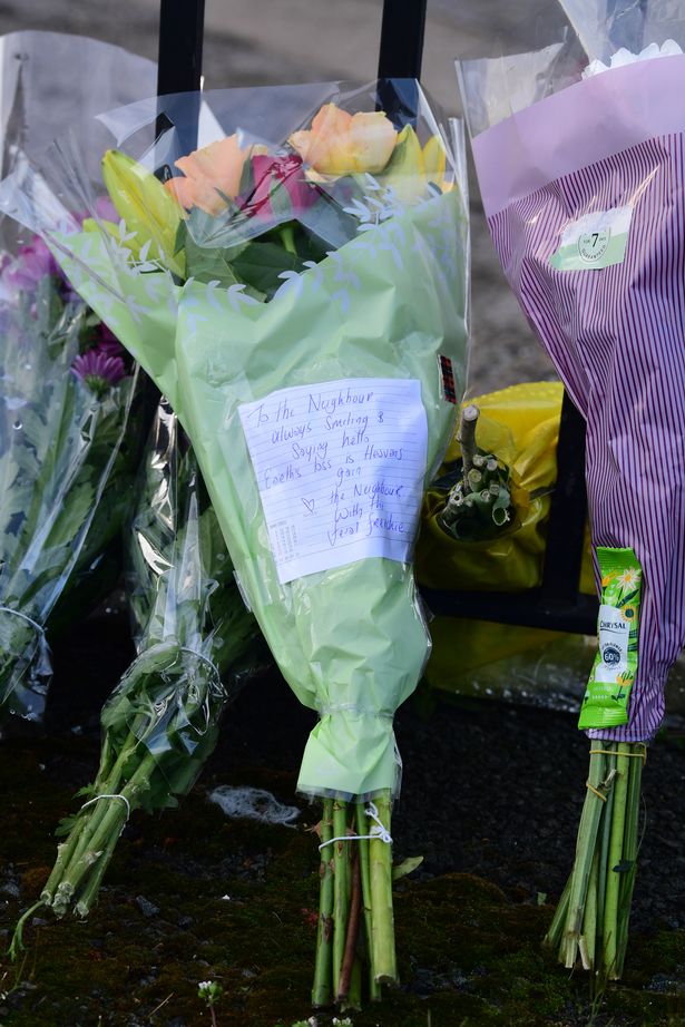 Floral tributes outside Knowsley Heights