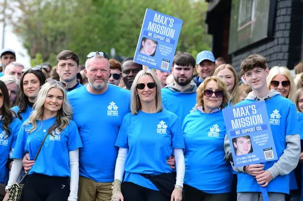 Family and friends walk in memory of Max Greenhouse including his parents Andy and Ally (centre left)