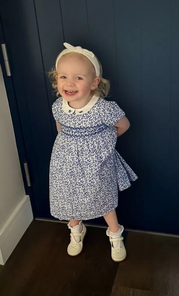 Lauren Boland smiling in a blue dress