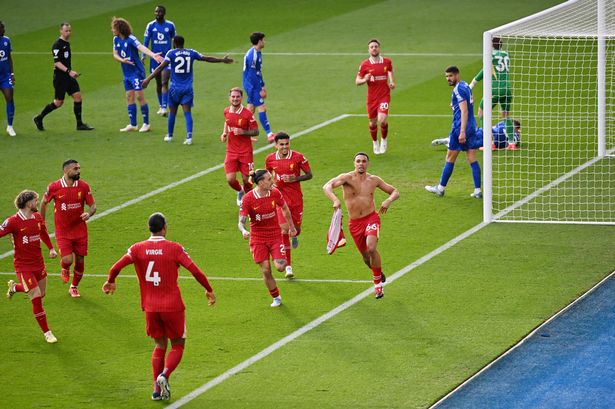 Trent Alexander-Arnold celebrates scoring for Liverpool as Leicester ity players appeal in the background