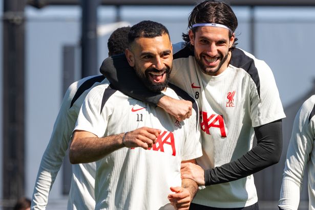 Mohamed Salah and Dominik Szoboszlai interacting during a Liverpool training session