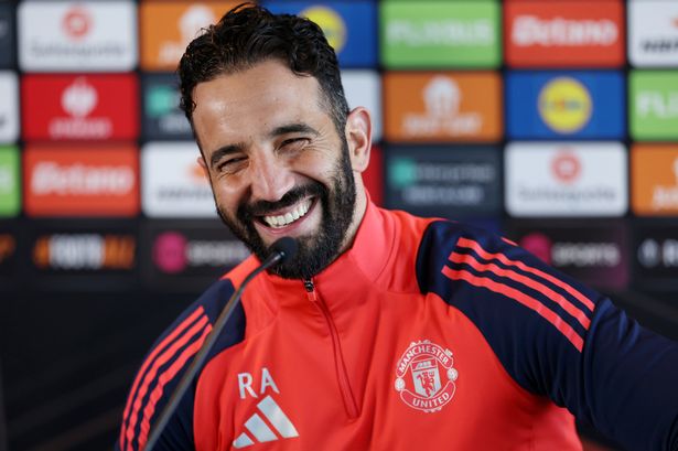 Ruben Amorim smiling during a Manchester United press conference