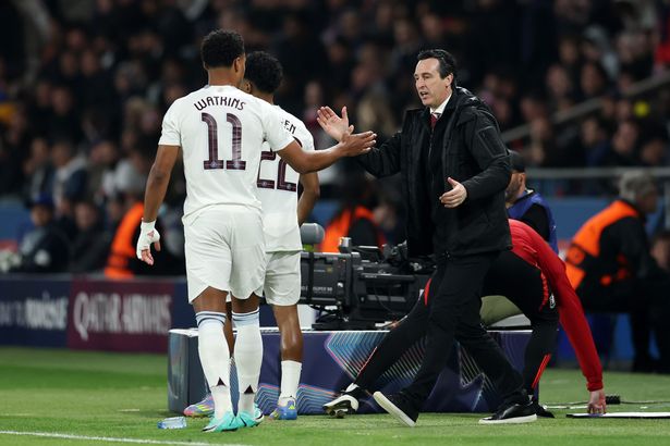 Ollie Watkins of Aston Villa high fives Unai Emery, manager of Aston Villa