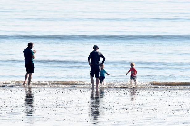 People enjoying beach on Filey