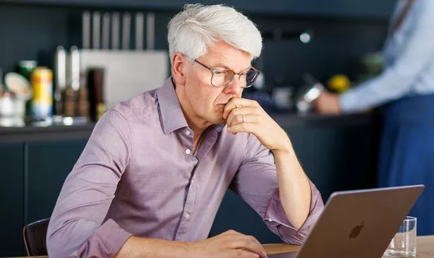 A man checks his finances