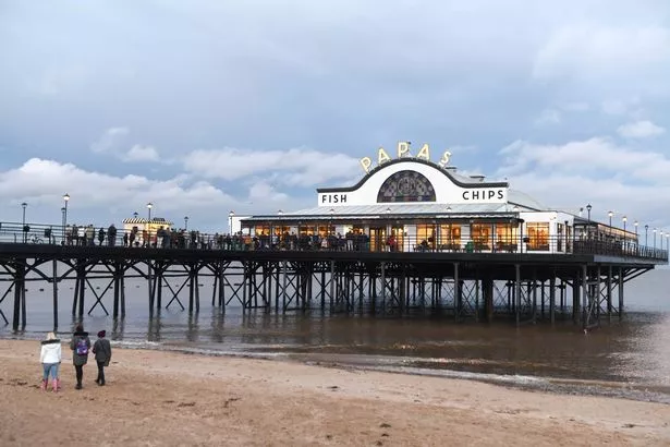 Scores of people queue on the Cleethorpes pier for the Papas Fish and Chips restaurant, Â£1 deal for fish and chips, to raise money for the Children in Need appeal.