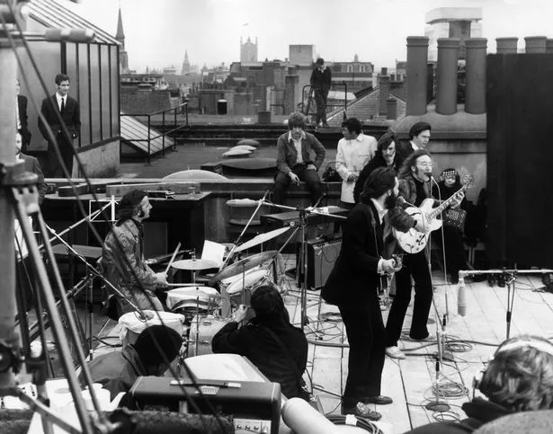 Rhe Beatles performing their last public concert on the rooftop of the Apple Organization building in 1969