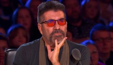 Louise Hall in a black top, floral shirt and blue jeans on the Britain's Got Talent stage with a microphone in an audition.