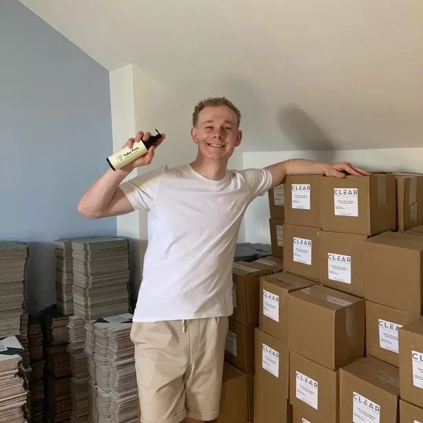A man in a room full of boxes