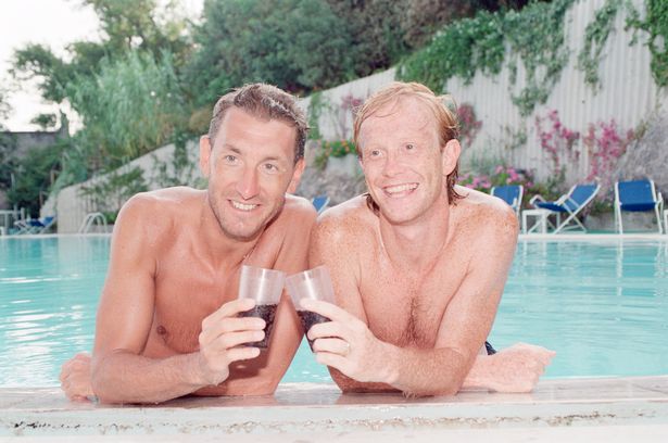 Mark Wright and teammate Terry Butcher relax at England's team hotel in 1990