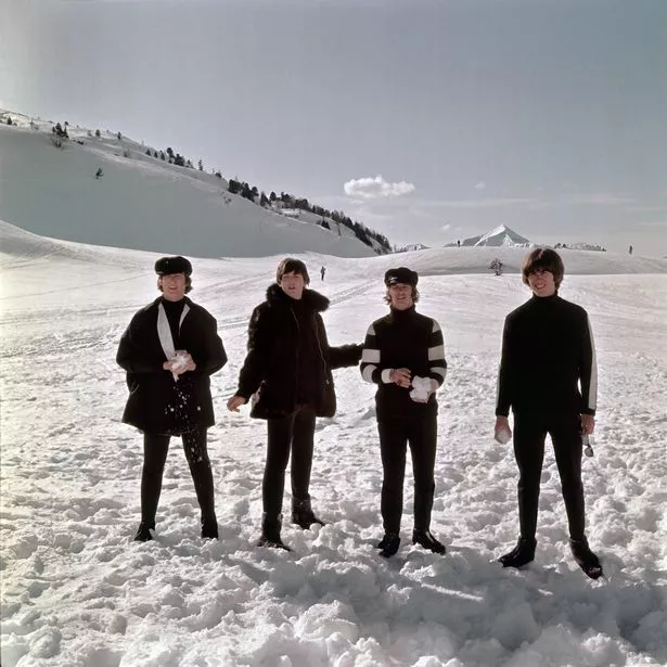 John Lennon, Paul McCartney, Ringo Starr and George Harrison pose for a photo in the snow in March 1965 in Obertauern, Austria