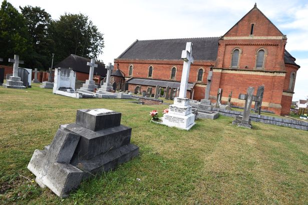 Broken headstone in the graveyard at Our Lady of Compassion Church, Formby in 2022