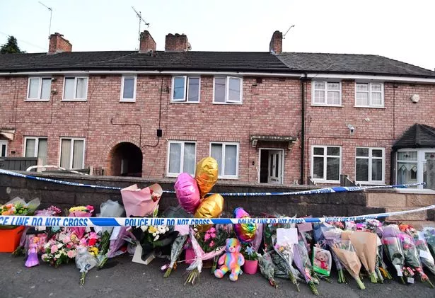 Bouquets of flowers, cards and teddy bears have been left outside the house