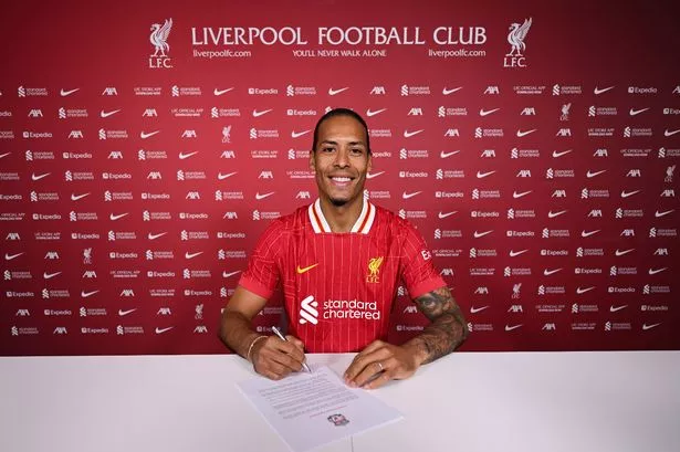 Virgil van Dijk signs a new Liverpool contract extension at Axa training centre.