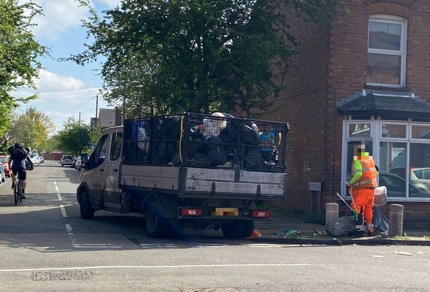 Bin bags in Kitchener Road, Selly Park in Birmingham are cleared by refuse workers on Thursday, April 24