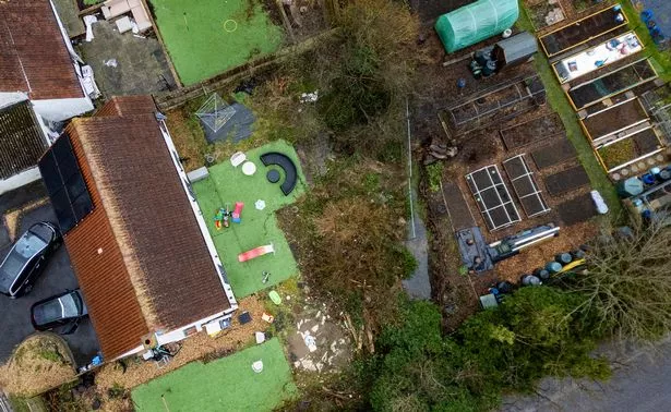 An overhead shot showing where the tree fell into their back garden