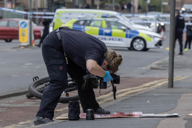 Forensics investigators gather evidence from a double stabbing in Longsight