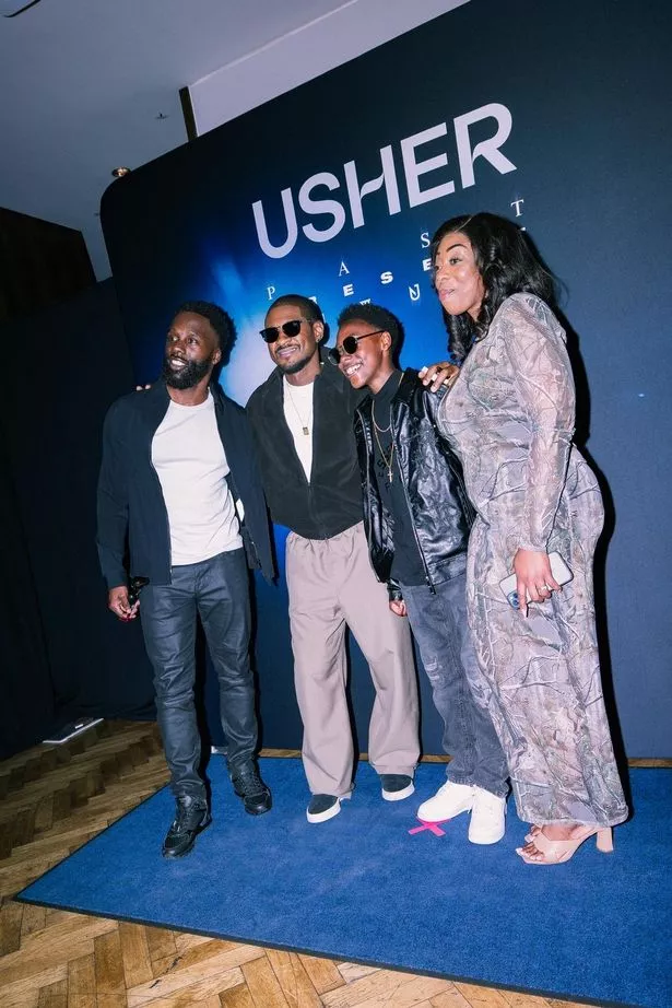Usher took pictures and chatted with the Powell family 
