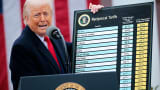  U.S. President Donald Trump holds up a chart while speaking during a “Make America Wealthy Again” trade announcement on April 2, 2025 in Washington, DC.