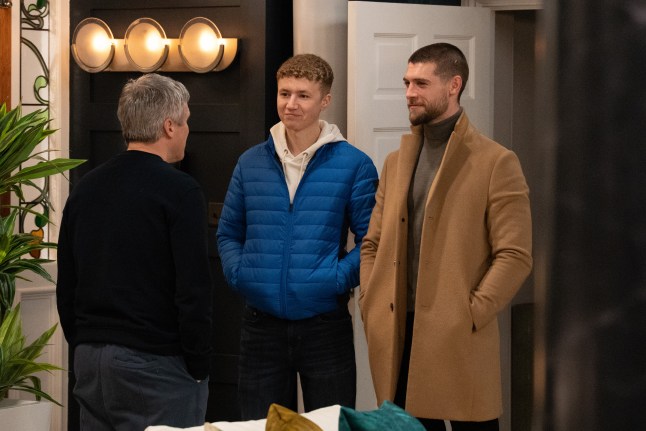 Caleb Miligan, Noah Dingle and Joe Tate standing in Mill Cottage in Emmerdale.