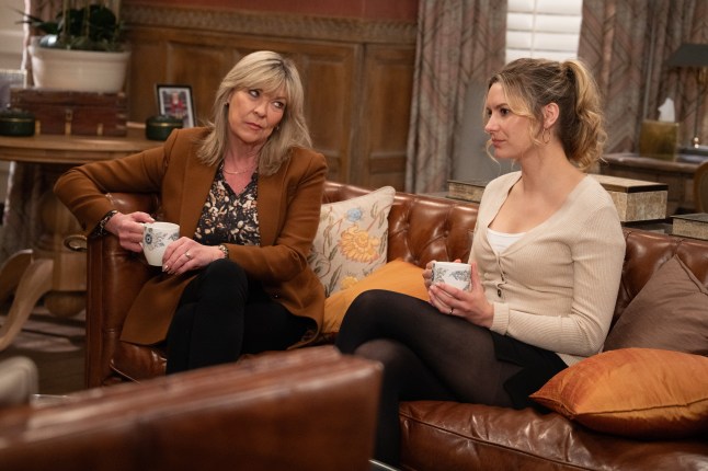 Kim Tate giving Dawn Taylor a knowing look in Emmerdale.