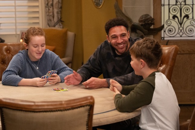 Billy playing cards with Clemmie and Lucas in Emmerdale