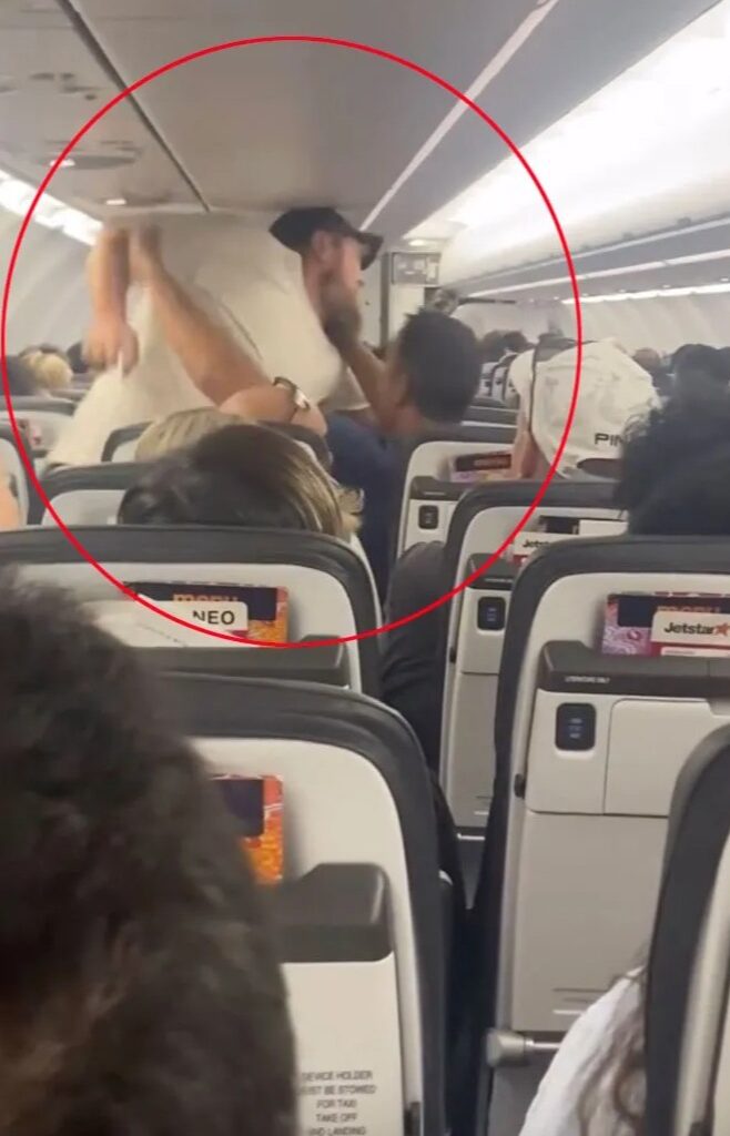 Watch shocking moment passengers clash over reclined seat as mid-air brawl erupts on busy flight to party hotspot
