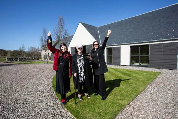 atricia Moule, middle,  Omaze Winner outside her new £4m home in Scotland. With grand daughter Louisa, left, and Daughter Sarah on right.