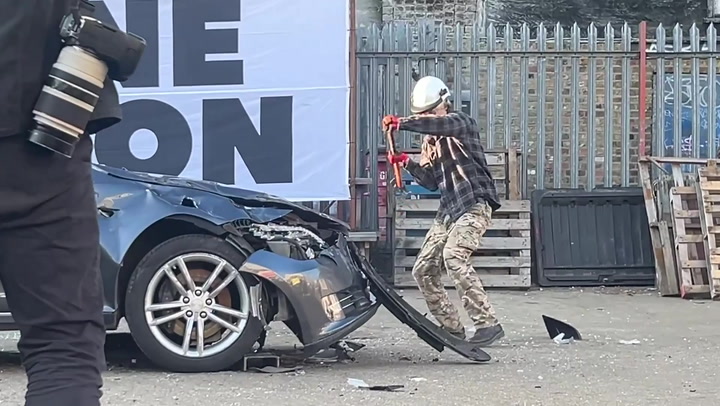 Tesla smashed to pieces in London protest against Elon Musk