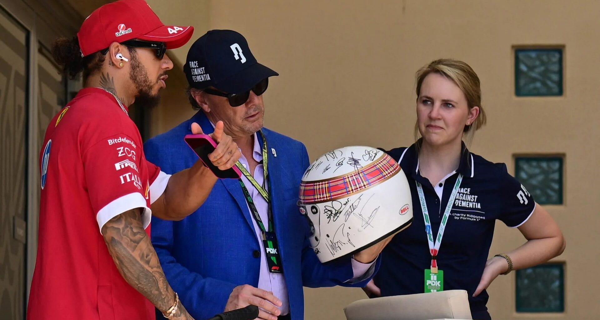 Michael Schumacher signs helmet to be worn by fellow F1 champion at Bahrain Grand Prix
