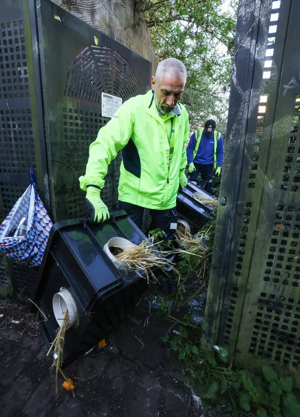 The Sefton Council fly-tipping clearing team clean out an entry in Bootle