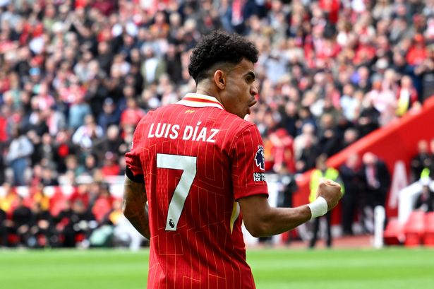 Luis Diaz celebrates scoring for Liverpool at Anfield during a Premier League match