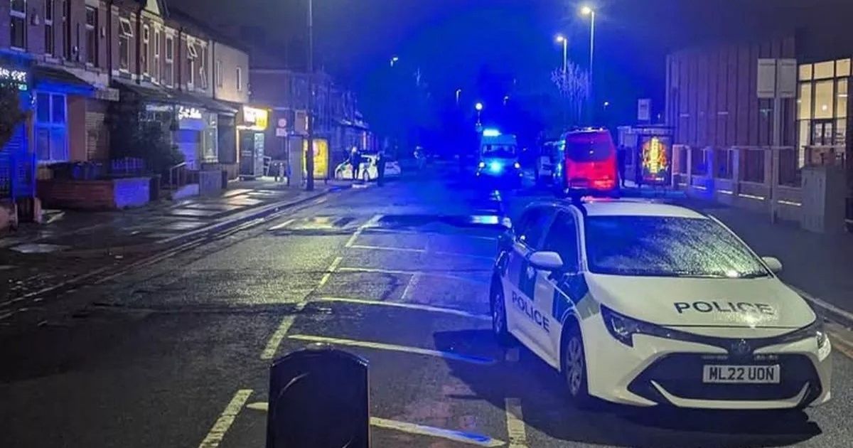 Salford incident: Armed police and helicopter swarm city estate as streets on lockdown