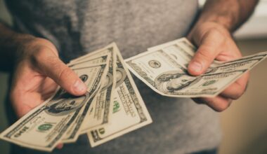 A man holds dollars in his hands stock photo
