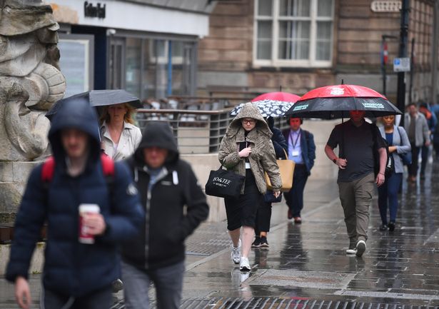 Covering up from the rain in the city centre