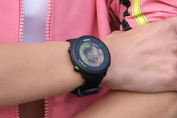 Person wearing a Garmin smart watch