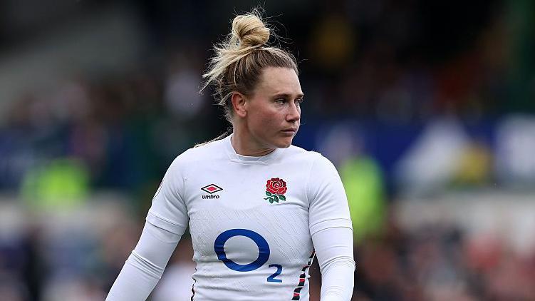 Megan Jones standing on the pitch during a Six Nations match for England
