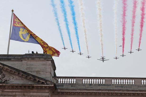 A fly-past of the Red Arrows fly over Buckingham Palace during Trooping the Colour in 2023.