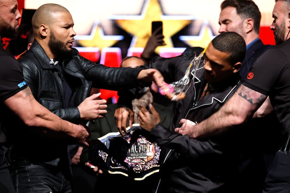 Chris Eubank Jr slaps Conor Benn with an egg during a press conference