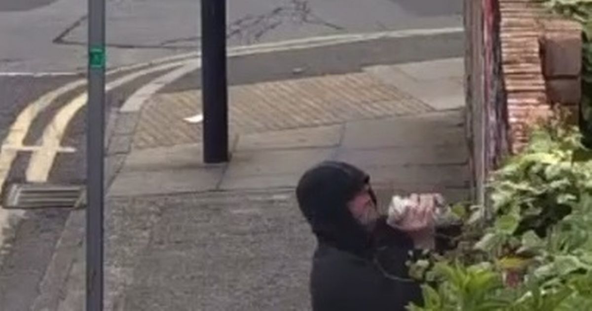 Mural celebrating Liverpool FC title win vandalised by hooded man