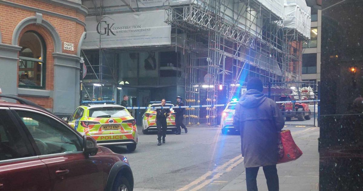Street closed off by police as 'kids climb scaffolding' around city centre building