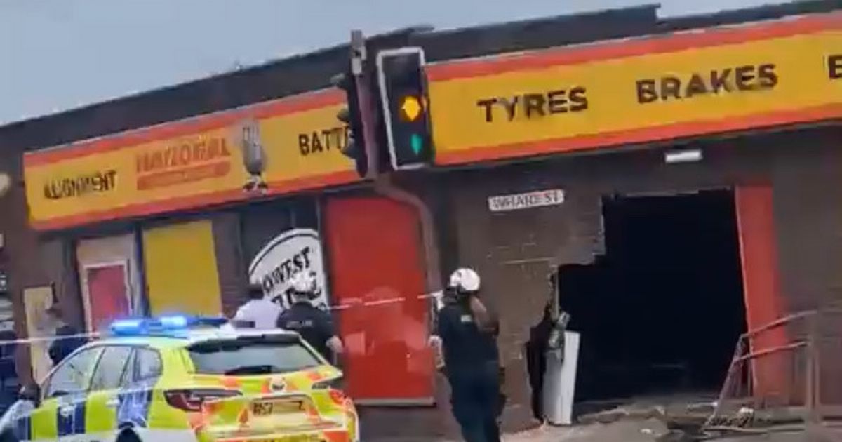 Residents hear 'loud bang' as car ploughs into side of National Tyres garage