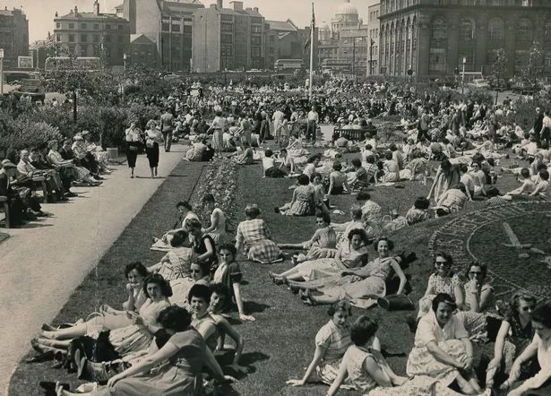 Summer 1957, and Coronation Gardens - off Lord Street - is packed with office workers and shoppers enjoying lunch and watching a performance by the band of the 1st Battalion of the King's Regiment