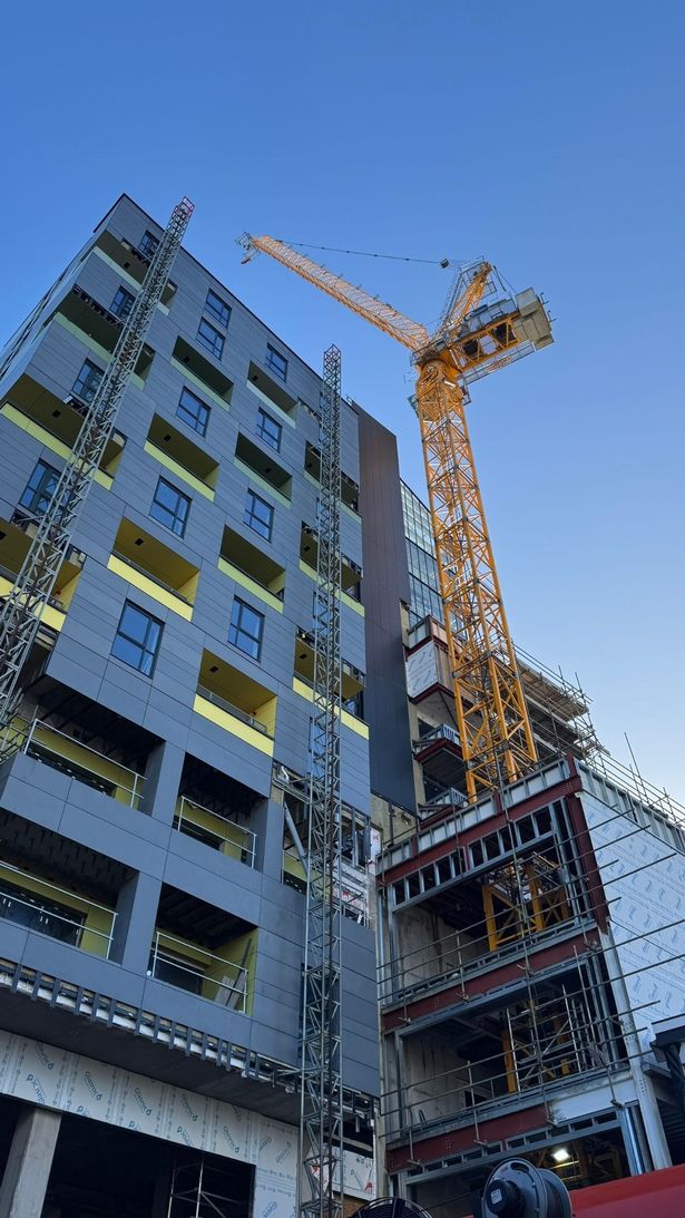 A crane working on a building construction