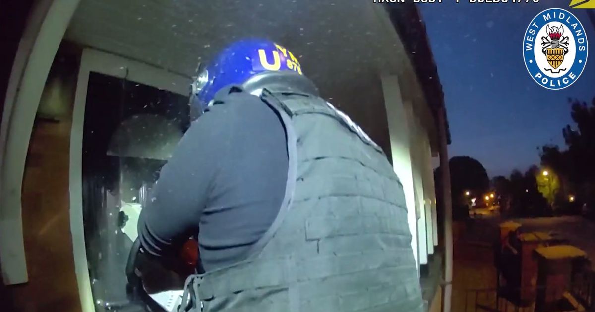 Dramatic moment police chainsaw through Birmingham door to arrest man