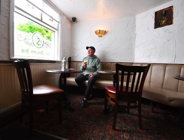 A regular enjoying a pint at the Unicorn Inn, Cronton
