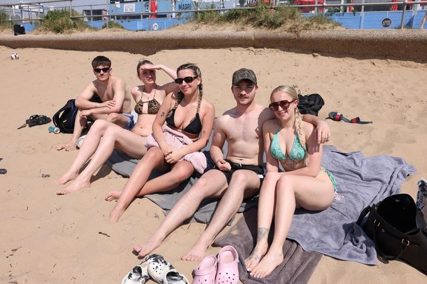 Tom, Wiki, Katie, Joss and Ellie enjoy the hot weather on Crosby marina this afternoon