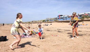 Crosby beach full of people enjoying mini-heatwave