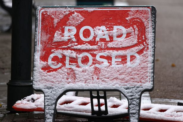 Generic road closed sign . Snow has fallen on parts of Greater Manchester overnight